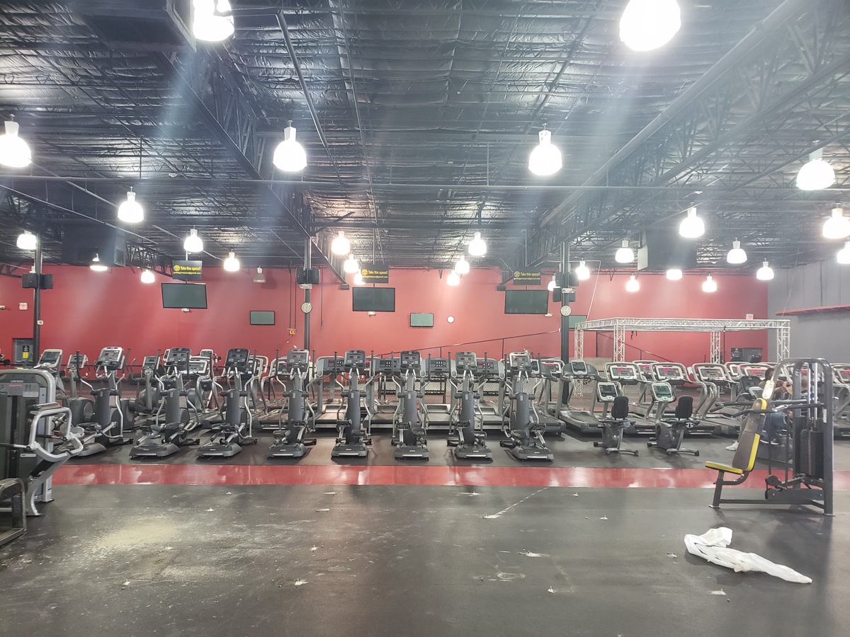 Full gym floor with rows of cardio equipment