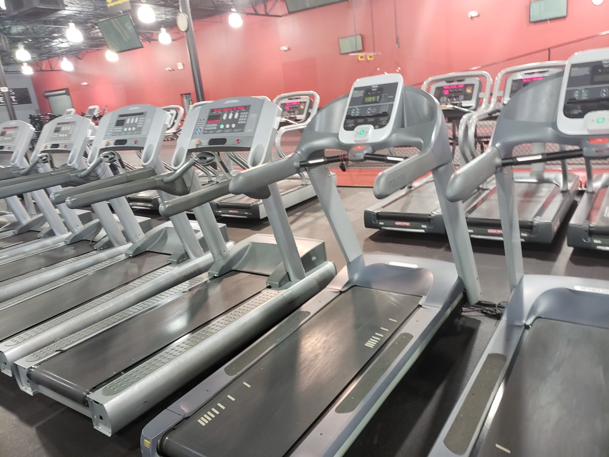 Row of treadmills on gym floor
