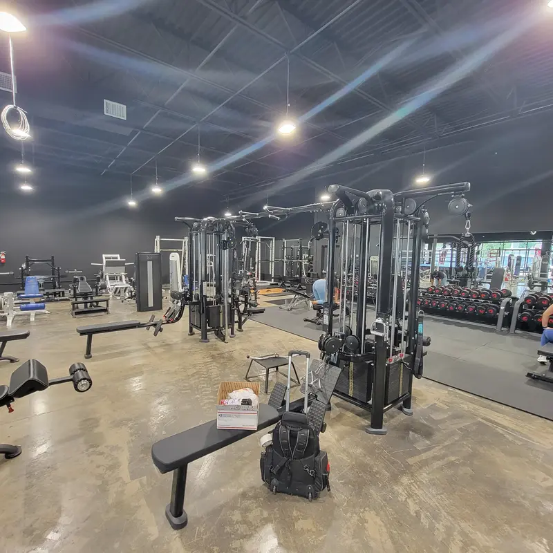 Commercial gym floor with strength equipment and cable machines serviced by Fitness Repair Xperts Houston