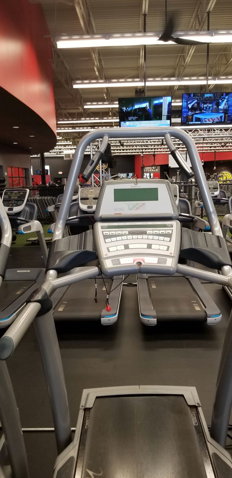 Elliptical machine closeup being serviced