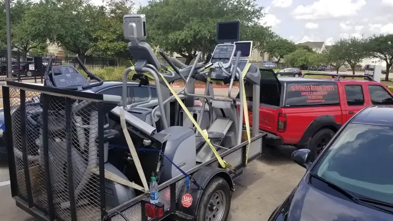 Fitness Repair Xperts trailer loaded with Precor equipment for gym delivery Houston TX