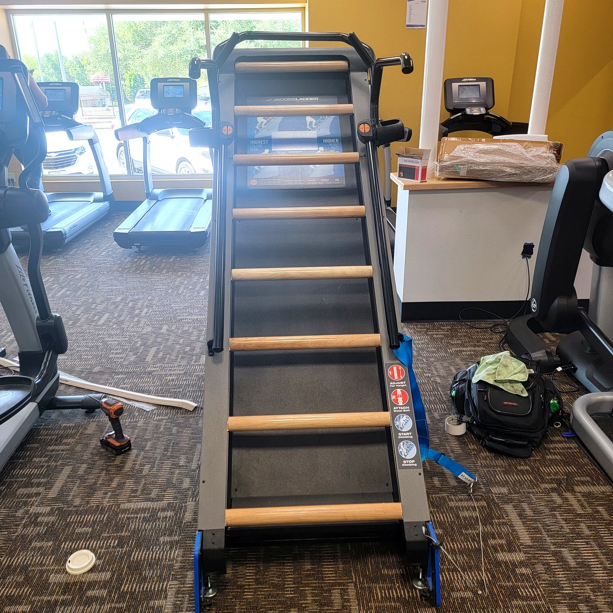 Treadmill belt installation and maintenance in progress